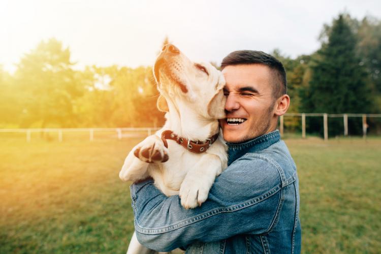 Man holding happy dog