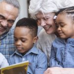 Grandparents reading to grandchildren