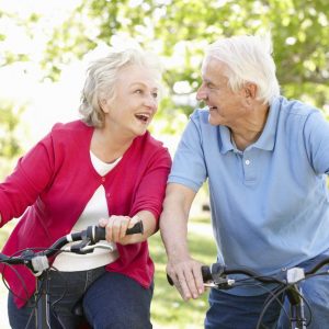 Senior Man and Woman riding bikes