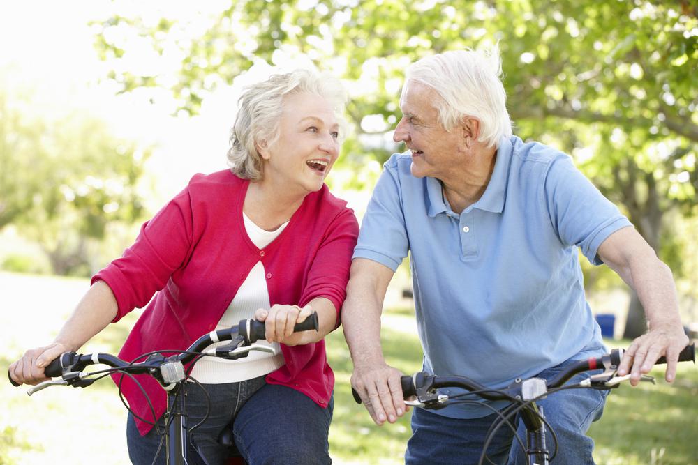 Senior Man and Woman riding bikes